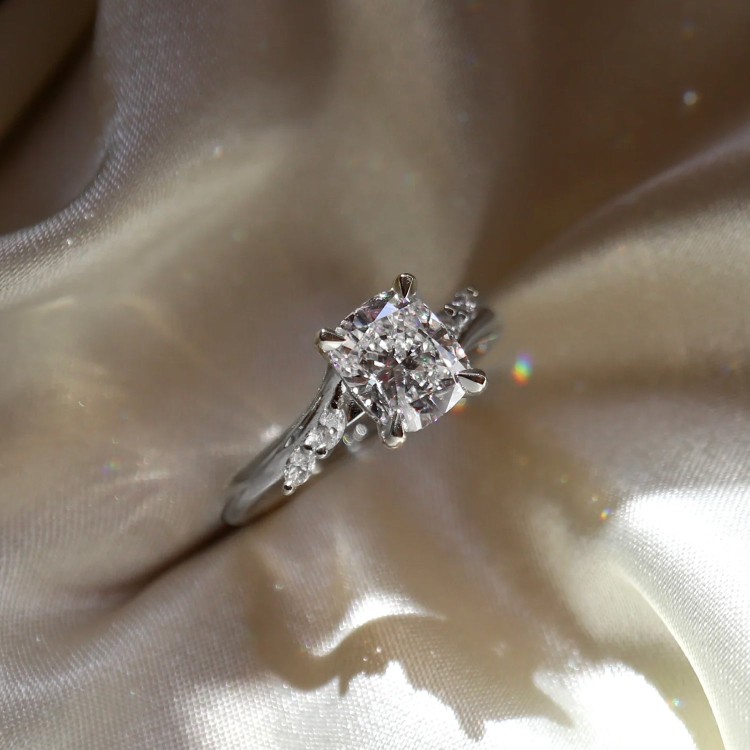 The Side Stone Elara Cushion Moissanite Ring - KNT - Engagement Rings, Wedding Bands & Fine Jewelry