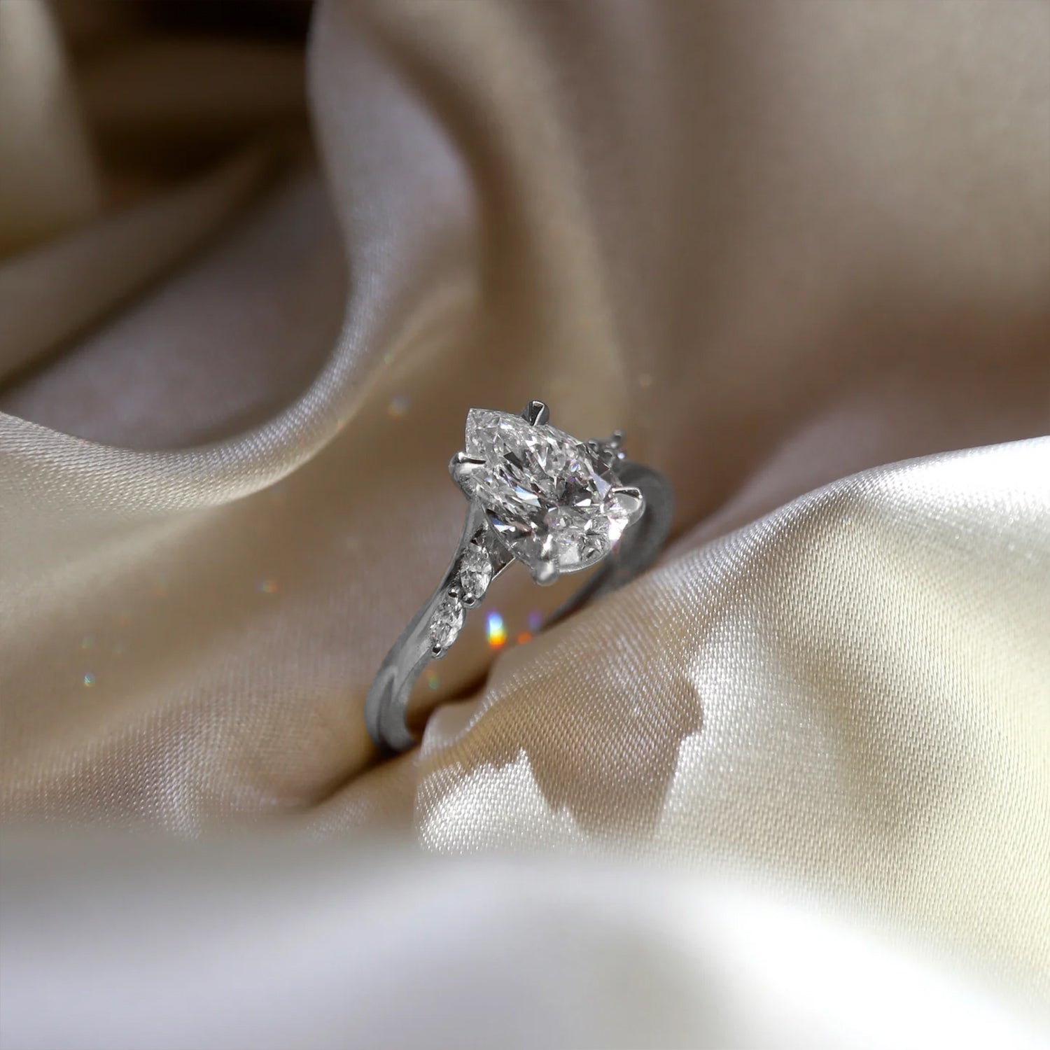 The Side Stone Elara Pear Moissanite Ring - KNT - Engagement Rings, Wedding Bands & Fine Jewelry