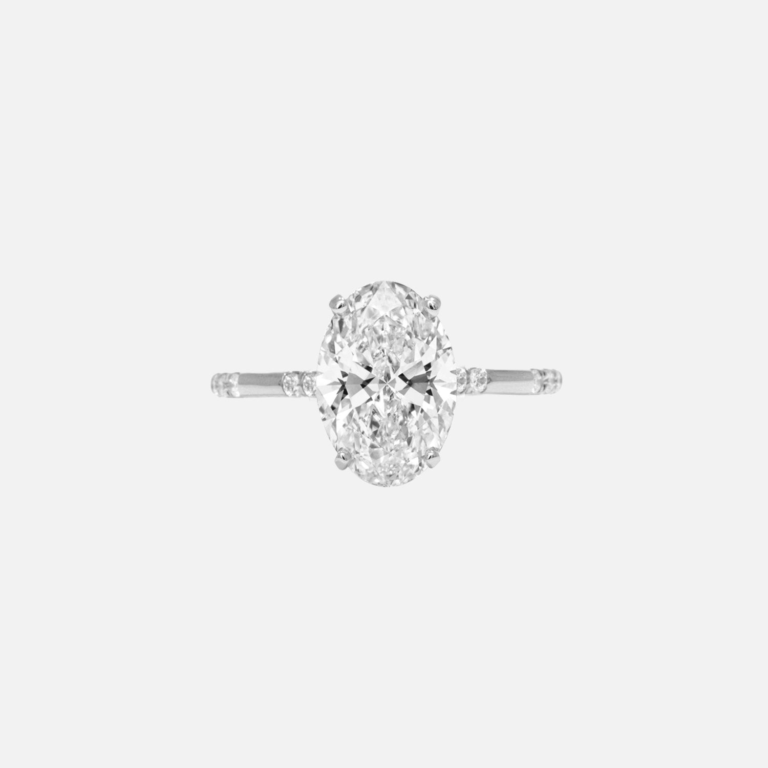 https://cdn.shopify.com/s/files/1/0575/1033/0564/files/Elysian_Moissanite_Oval_14k_White_Gold_1.jpg?v=1728033622